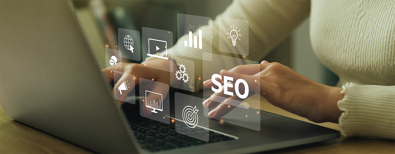 yolo-1280x500-seo Woman typing on a laptop, SEO for nursing homes graphics layered on top